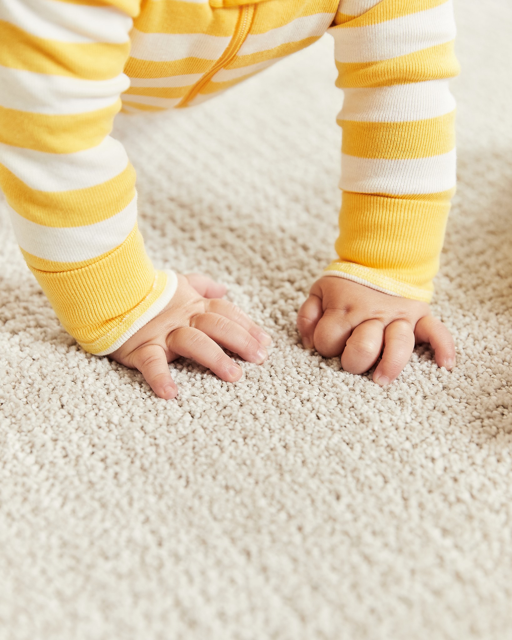 Baby crawling on carpet
