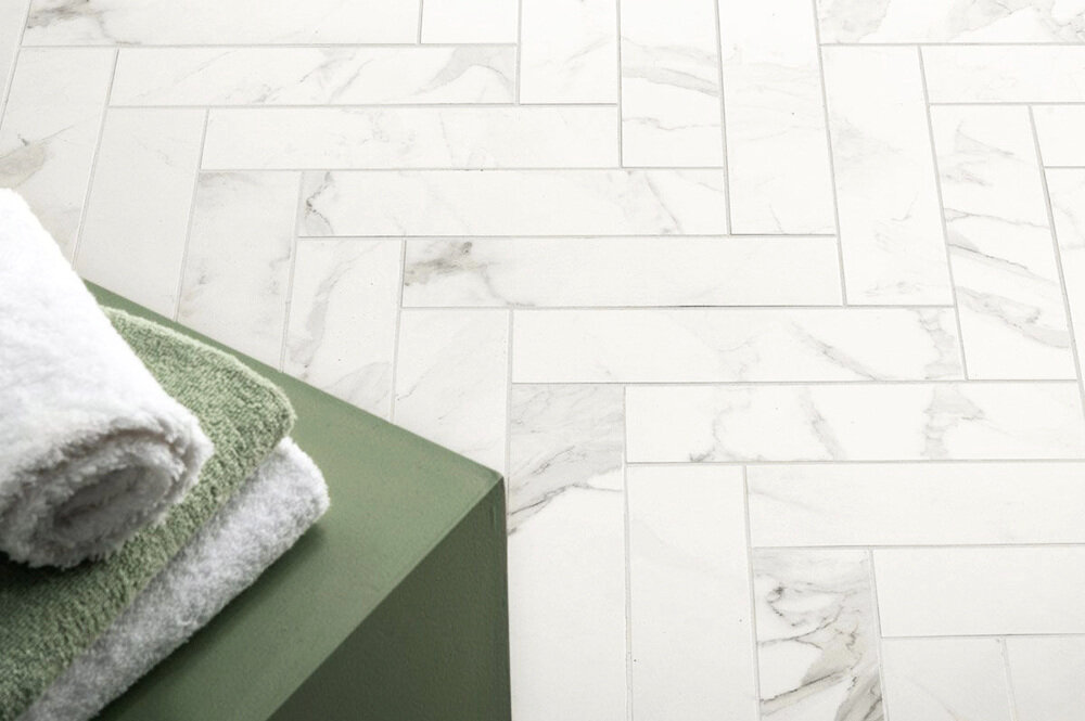 White marble tile in a herringbone pattern
