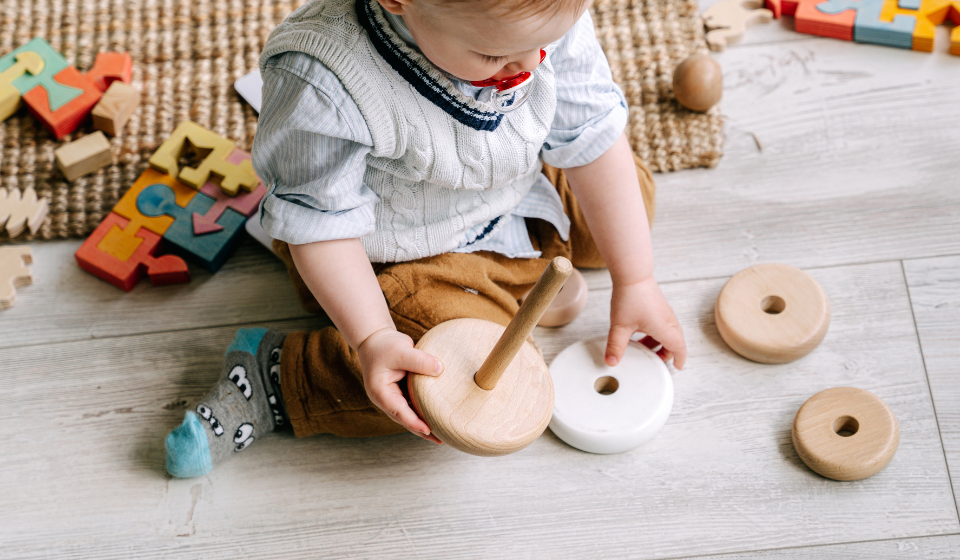 Baby playing on luxury vinyl plank flooring